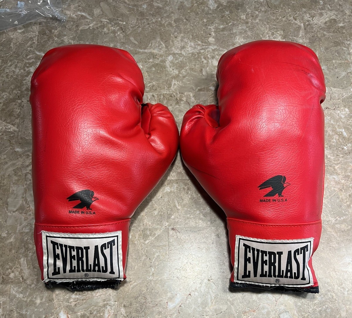 Illustrative example of boxing gloves retro from Google Search