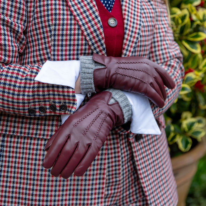 Illustrative example of burgundy leather gloves from Google Search