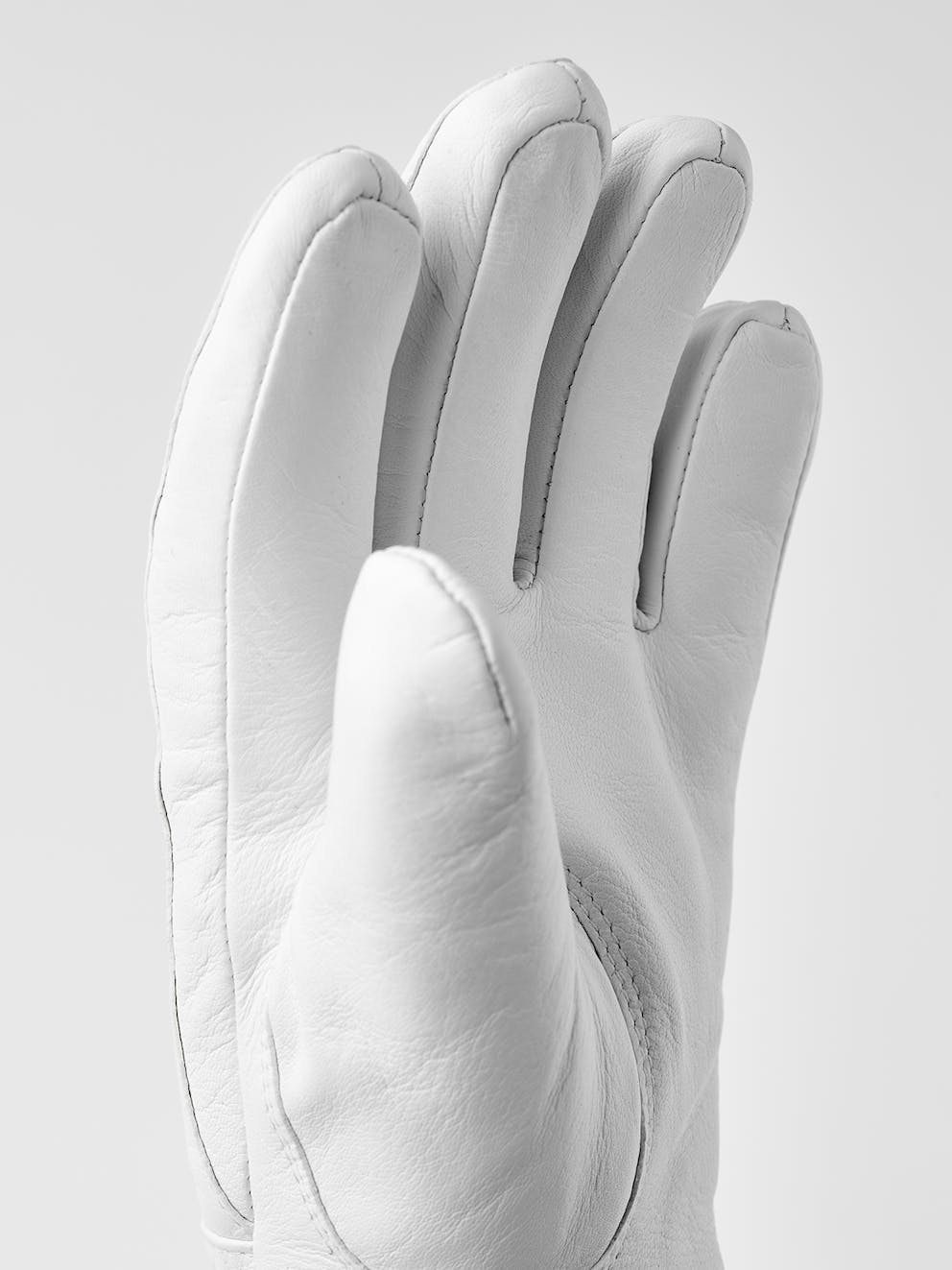 Illustrative example of white leather gloves from Google Search